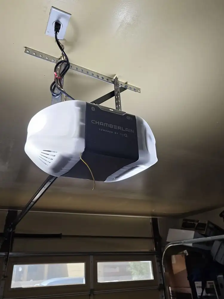 Garage door opener mounted on a garage ceiling