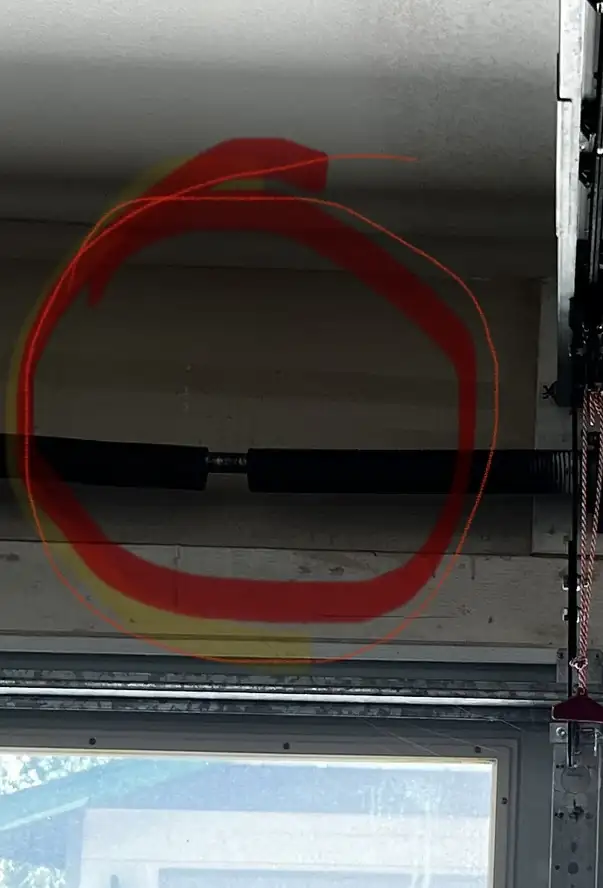 Break in a torsion spring, circled in red