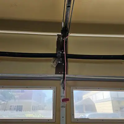 Spring and center bracket above windows